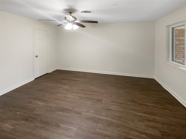 unfurnished room featuring dark hardwood / wood-style floors and ceiling fan