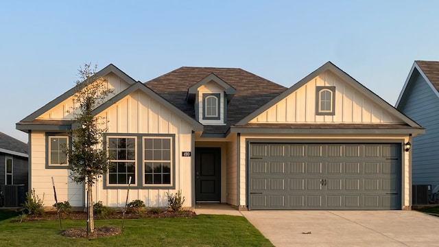 view of front of house with a garage and a front lawn