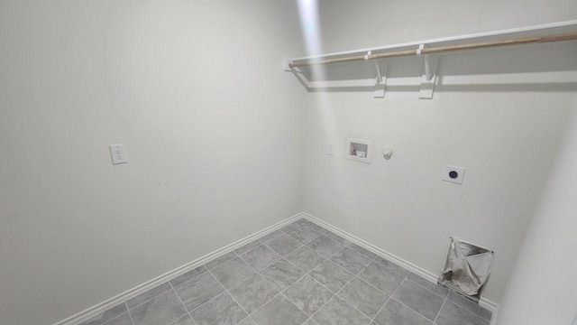 clothes washing area with hookup for a washing machine, gas dryer hookup, and electric dryer hookup