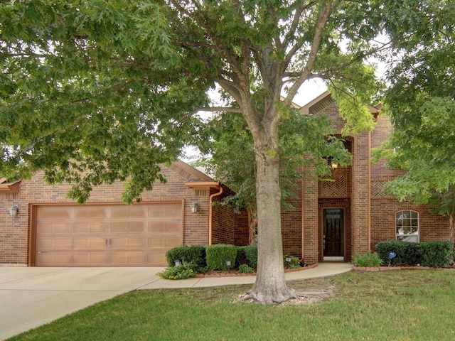 view of front of property with a garage and a front yard