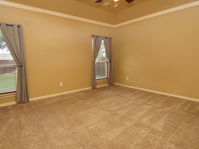 carpeted spare room featuring ornamental molding and ceiling fan