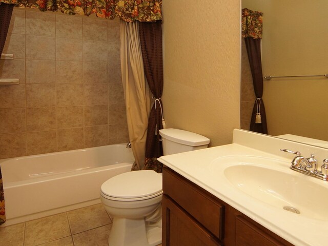 full bathroom featuring tile patterned floors, vanity, toilet, and shower / bath combo