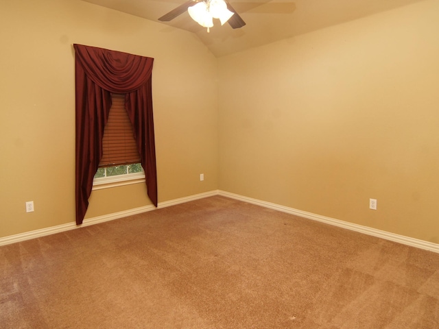 unfurnished room with ceiling fan, carpet, and lofted ceiling