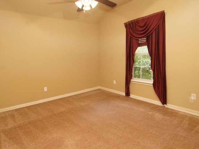 carpeted spare room with ceiling fan