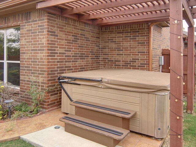 exterior details with tile patterned floors and a hot tub