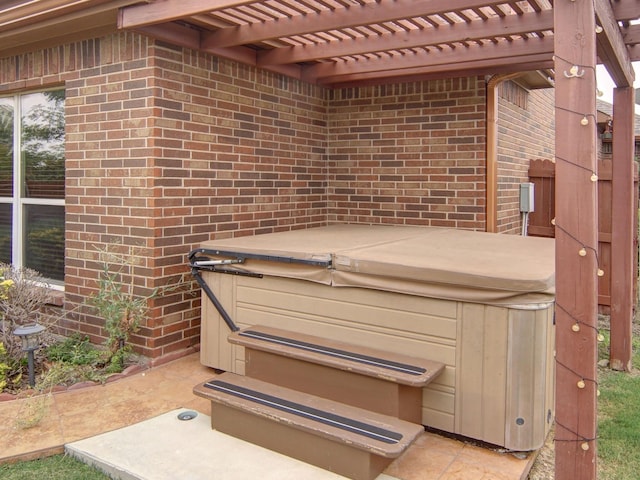 details with a hot tub and a pergola