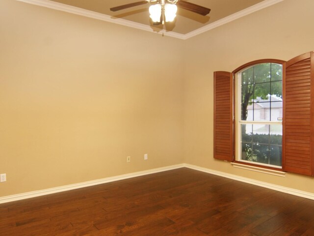 empty room featuring ceiling fan, dark hardwood / wood-style flooring, and ornamental molding