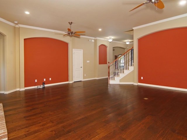 unfurnished living room featuring ornamental molding, dark wood-type flooring, and ceiling fan