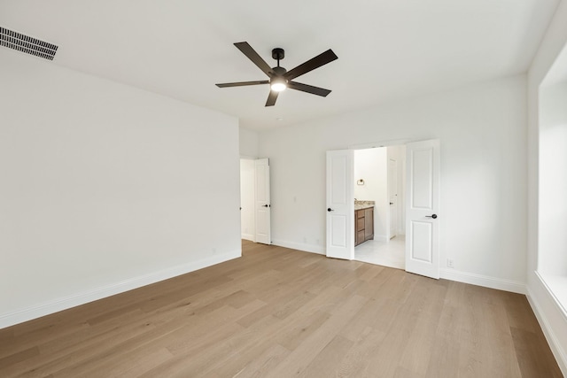 unfurnished bedroom featuring light hardwood / wood-style floors, ceiling fan, and ensuite bathroom