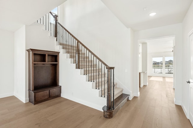 stairway with wood-type flooring