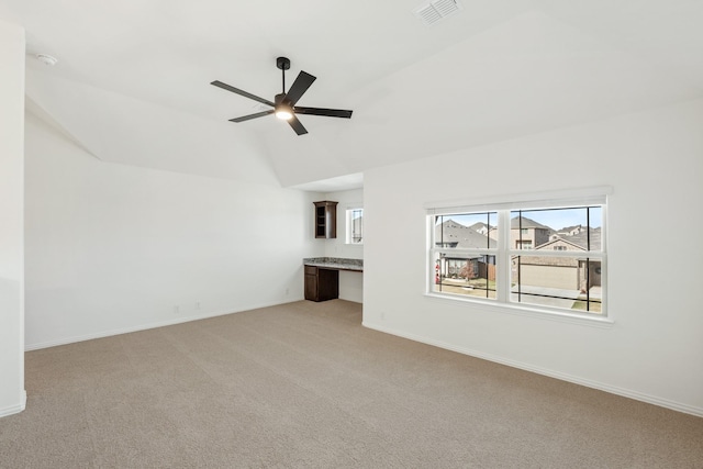 unfurnished living room with light carpet, ceiling fan, and lofted ceiling