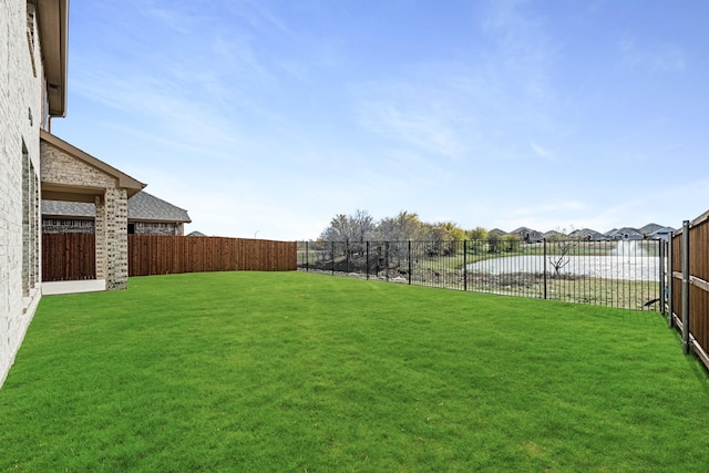 view of yard with a water view