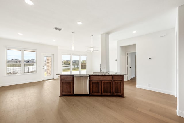 kitchen with dishwasher, a wealth of natural light, light hardwood / wood-style floors, and hanging light fixtures