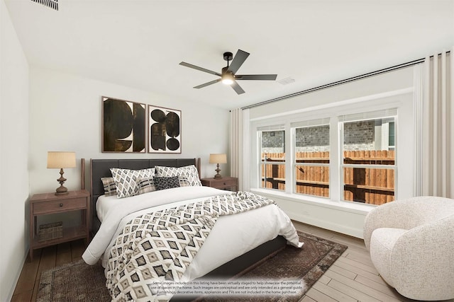 bedroom with ceiling fan and hardwood / wood-style floors