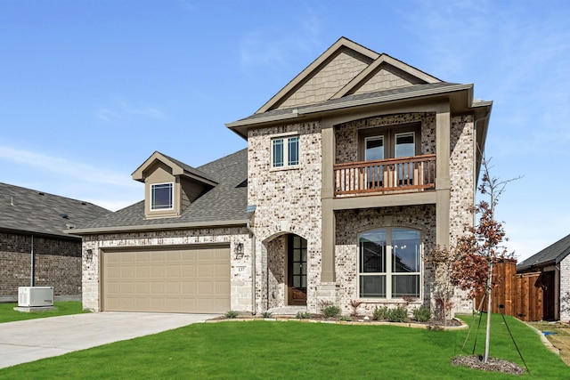 view of front of house featuring a balcony, a front lawn, and a garage