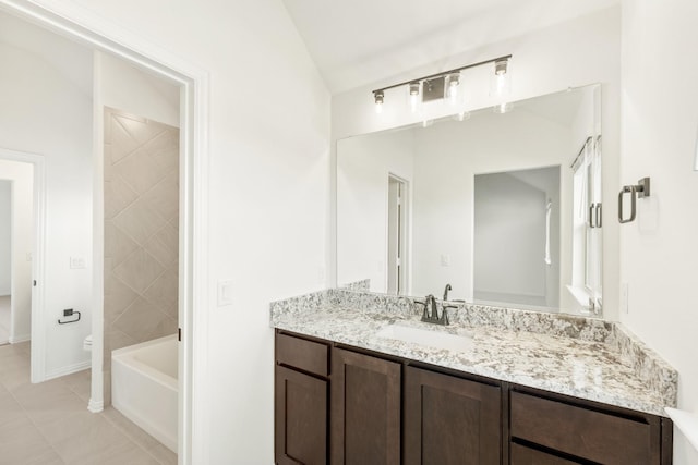 bathroom with tile patterned floors, vanity, and toilet