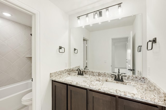 full bathroom featuring vanity, toilet, and tiled shower / bath combo