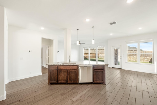 kitchen with stainless steel dishwasher, ceiling fan, sink, light hardwood / wood-style floors, and hanging light fixtures