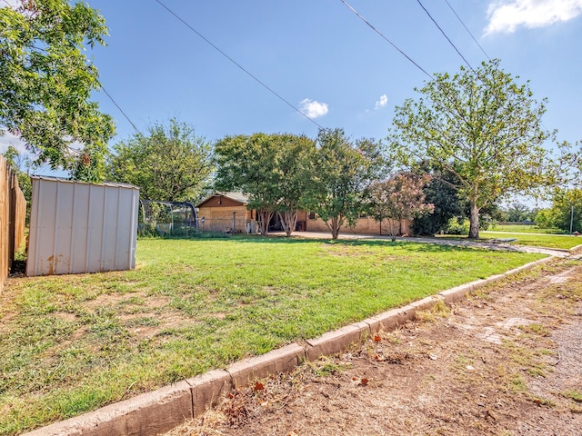 view of yard with a shed