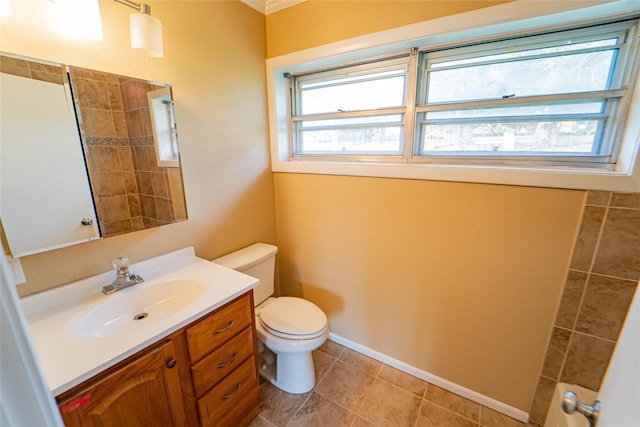 bathroom featuring vanity, toilet, and tile patterned flooring