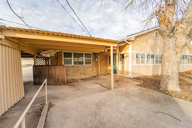 exterior space featuring a carport