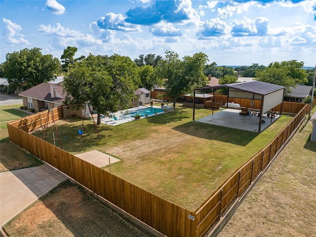 view of yard with a fenced in pool and a patio