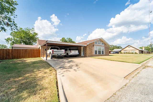 view of front of property featuring a front lawn and a carport