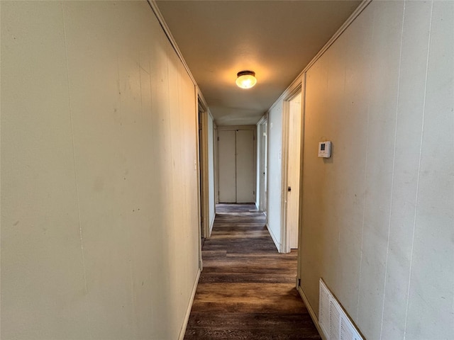 corridor featuring dark hardwood / wood-style flooring