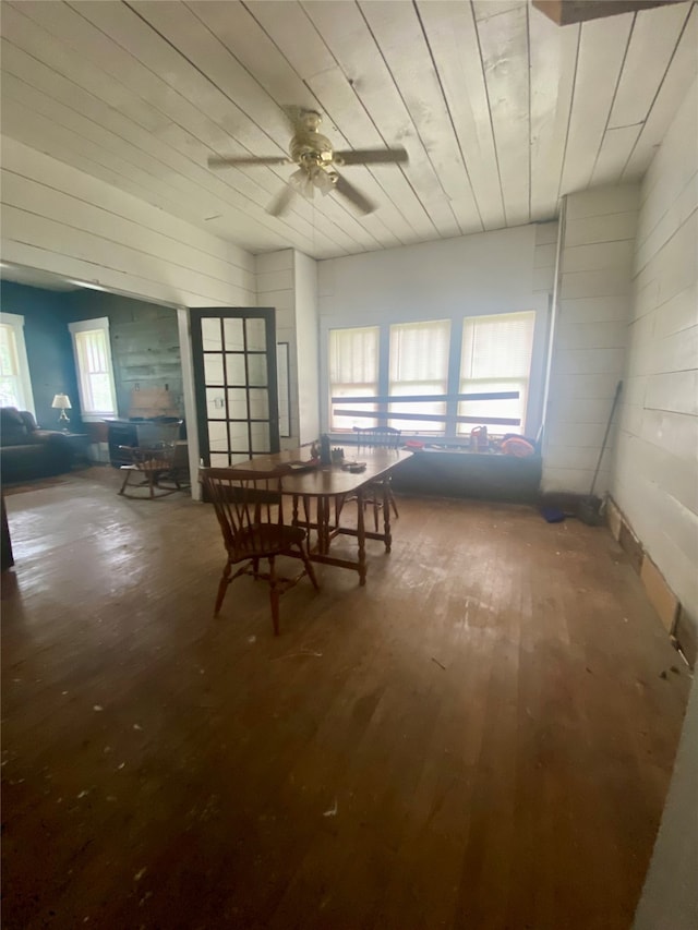 dining space with hardwood / wood-style flooring and ceiling fan