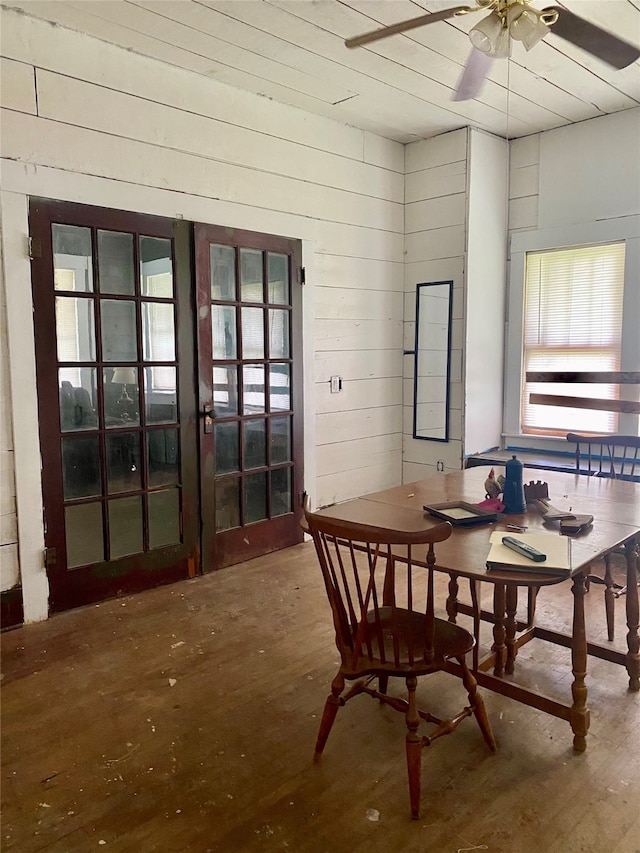 dining area with wood-type flooring and ceiling fan