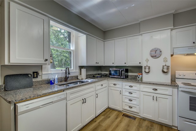 kitchen featuring sink, white appliances, stone counters, white cabinetry, and light hardwood / wood-style floors