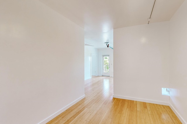 spare room with light wood-type flooring