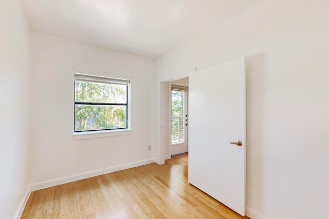 unfurnished room with light hardwood / wood-style flooring