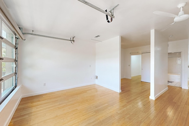 spare room featuring ceiling fan and light hardwood / wood-style floors