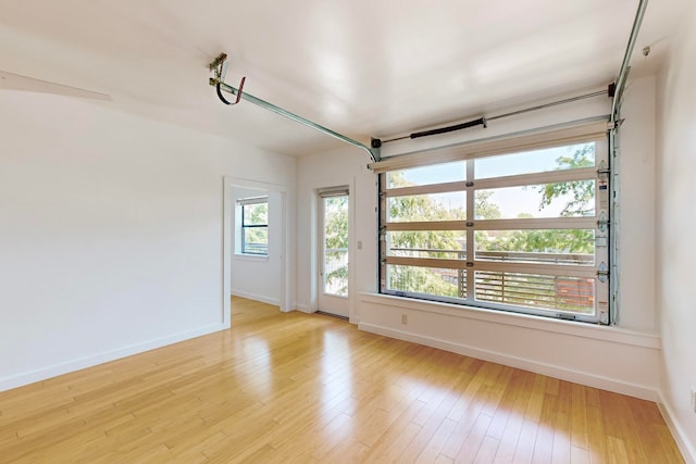 unfurnished room with light hardwood / wood-style floors