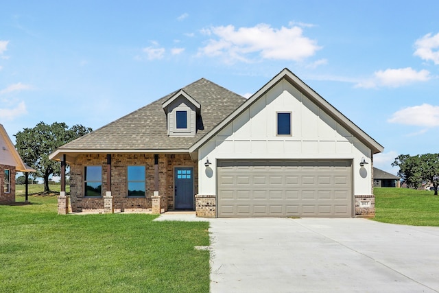 view of front of home featuring a front yard and a garage