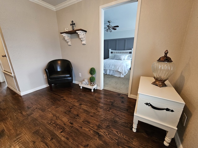 unfurnished room featuring baseboards, wood finished floors, a ceiling fan, and crown molding