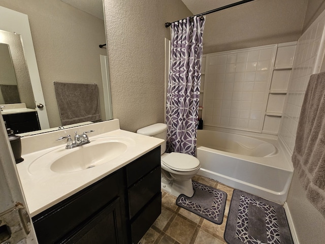 full bath featuring a textured wall, vanity, shower / bath combination with curtain, and toilet