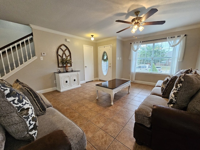 tiled living room featuring a textured ceiling, ornamental molding, and ceiling fan