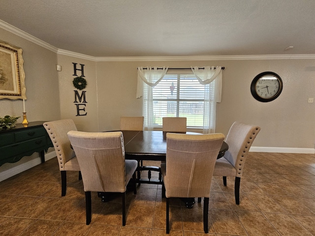 dining area featuring ornamental molding, tile patterned floors, and baseboards