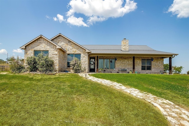 ranch-style house featuring a front yard