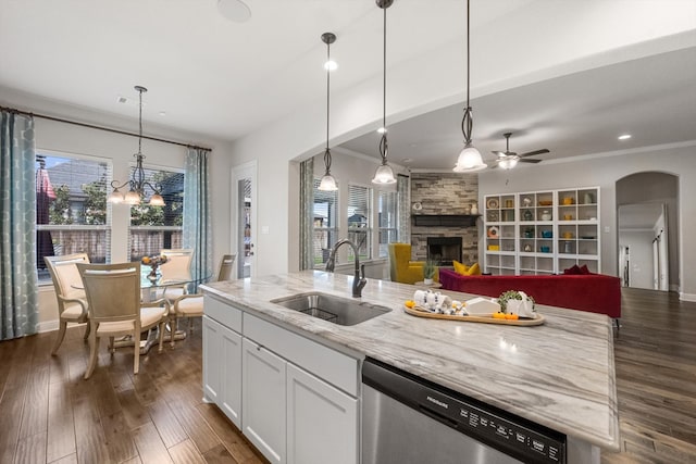 kitchen with dishwasher, white cabinets, pendant lighting, and plenty of natural light