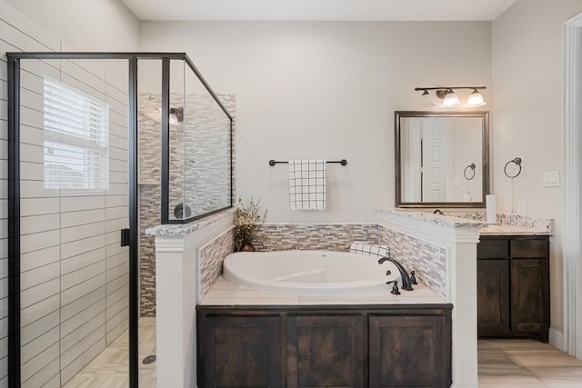 bathroom featuring plus walk in shower and vanity