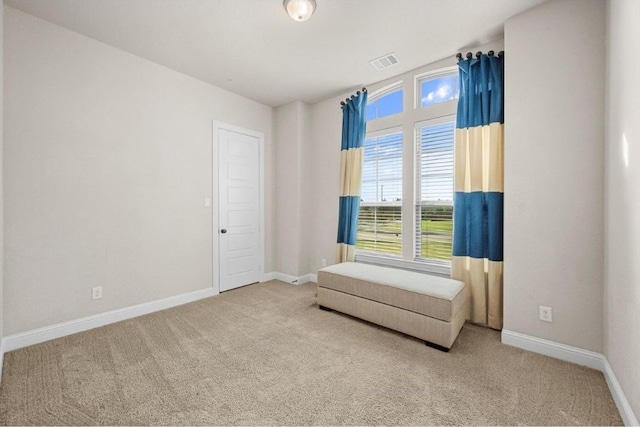 unfurnished room featuring carpet flooring