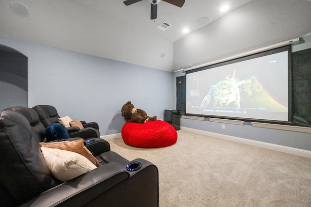 home theater room featuring carpet, vaulted ceiling, and ceiling fan