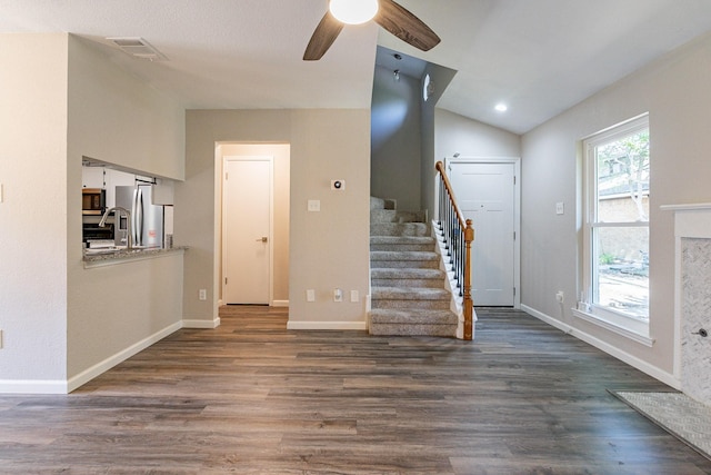 entryway featuring ceiling fan, dark hardwood / wood-style floors, and lofted ceiling