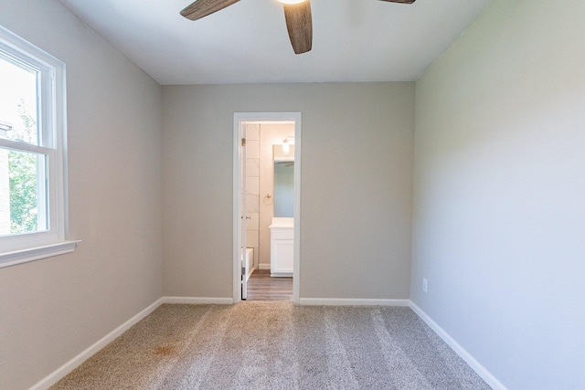 carpeted empty room with ceiling fan