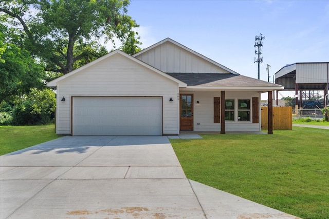 view of front of home with a garage and a front yard