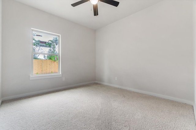 carpeted empty room featuring ceiling fan