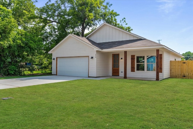 view of front facade featuring a garage and a front lawn